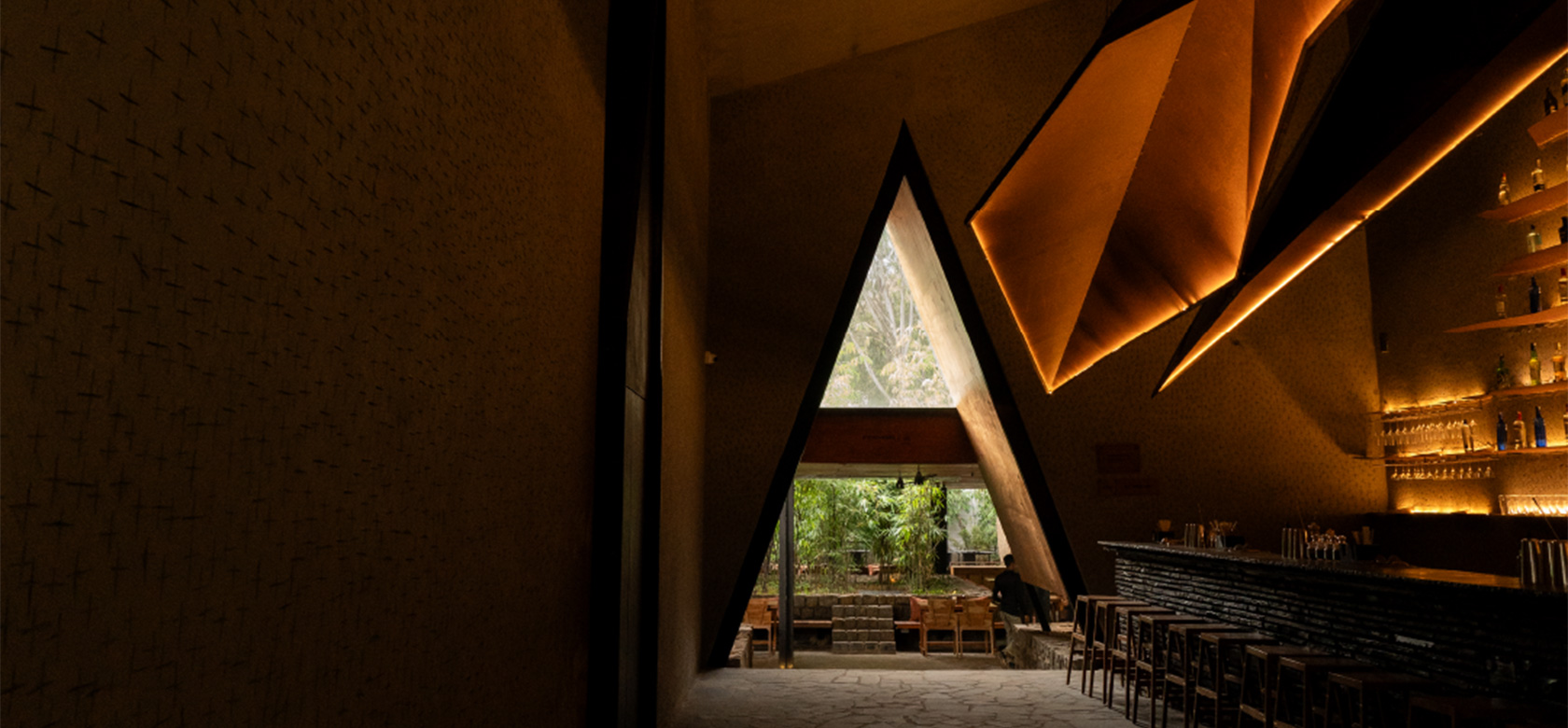 Outdoor dining area with trees and seating